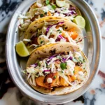 Fish Tacos With Cabbage Slaw and Zesty Lime Crema