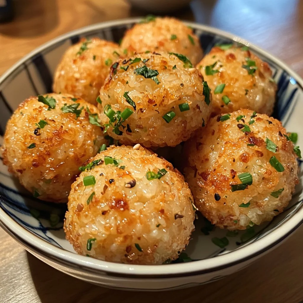 Deliciously prepared tuna rice balls on a plate, ready to be enjoyed.
