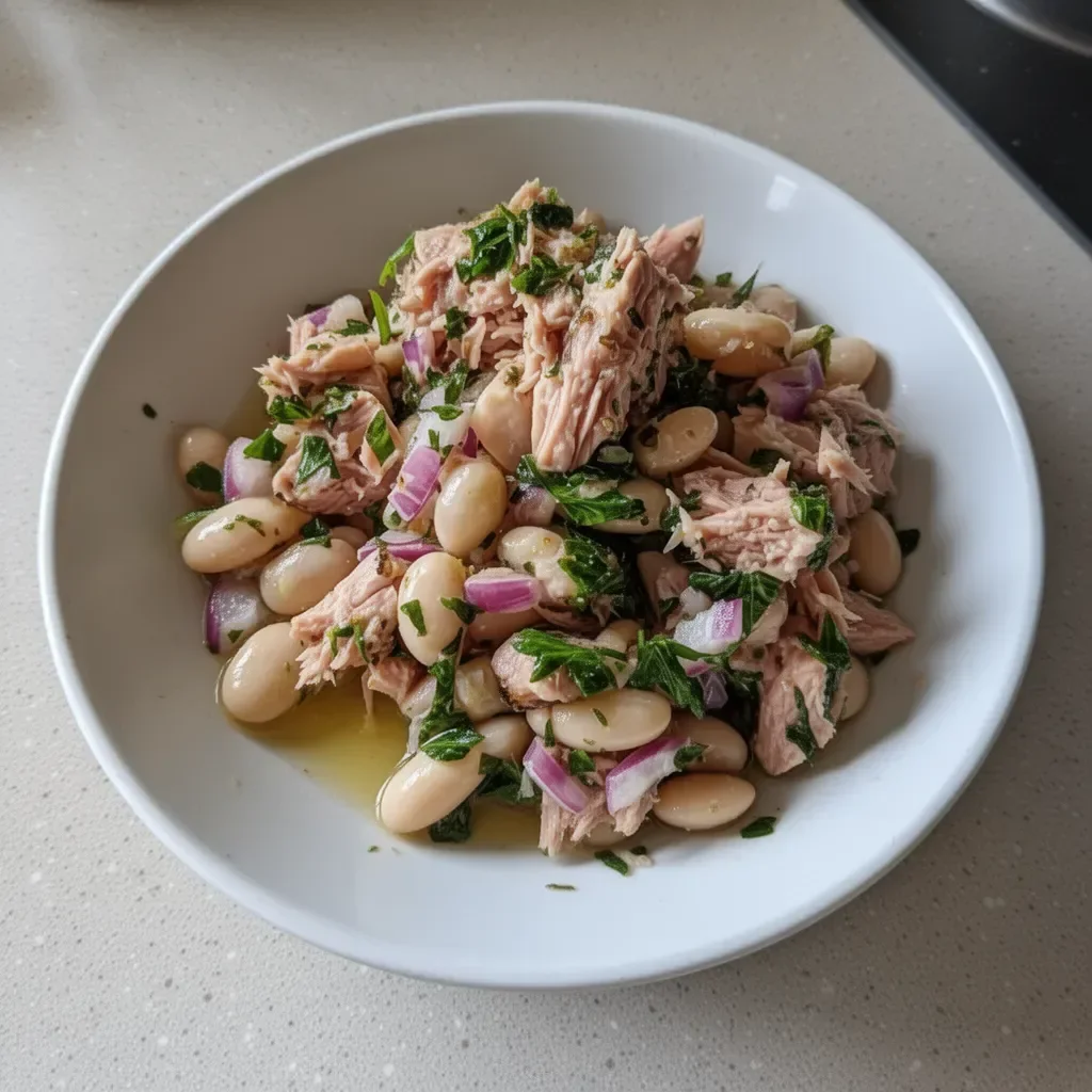 Delicious Tuna and White Bean Salad served in a bowl with fresh ingredients.